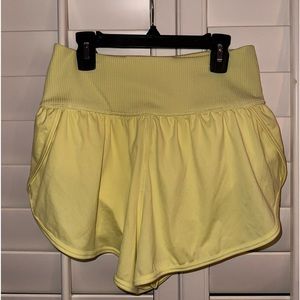 Free People Movement “Game Time” Shorts in Pale Yellow